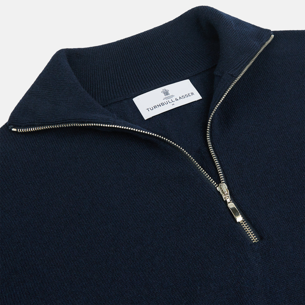 The Turnbull & Asser Navy Half-Zip Cashmere Jumper features a high collar and silver quarter-zip closure, shown flat on a white background.