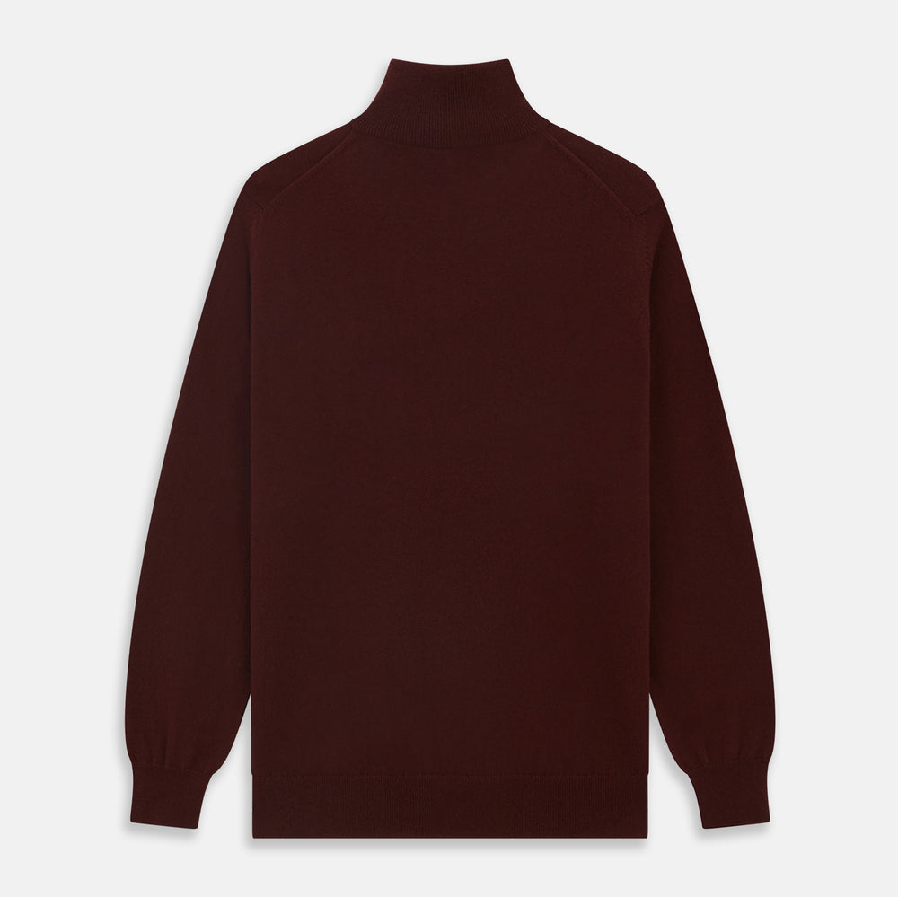 The Turnbull & Asser Port Cashmere Half-Zip Jumper is a dark maroon, long-sleeve style with a high collar, silver half-zip, and ribbed cuffs and hem, shown laid flat on a white background—ideal for layering.