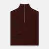 View 3 of product The Turnbull & Asser Port Cashmere Half-Zip Jumper is a dark maroon, long-sleeve style with a high collar, silver half-zip, and ribbed cuffs and hem, shown laid flat on a white background—ideal for layering.