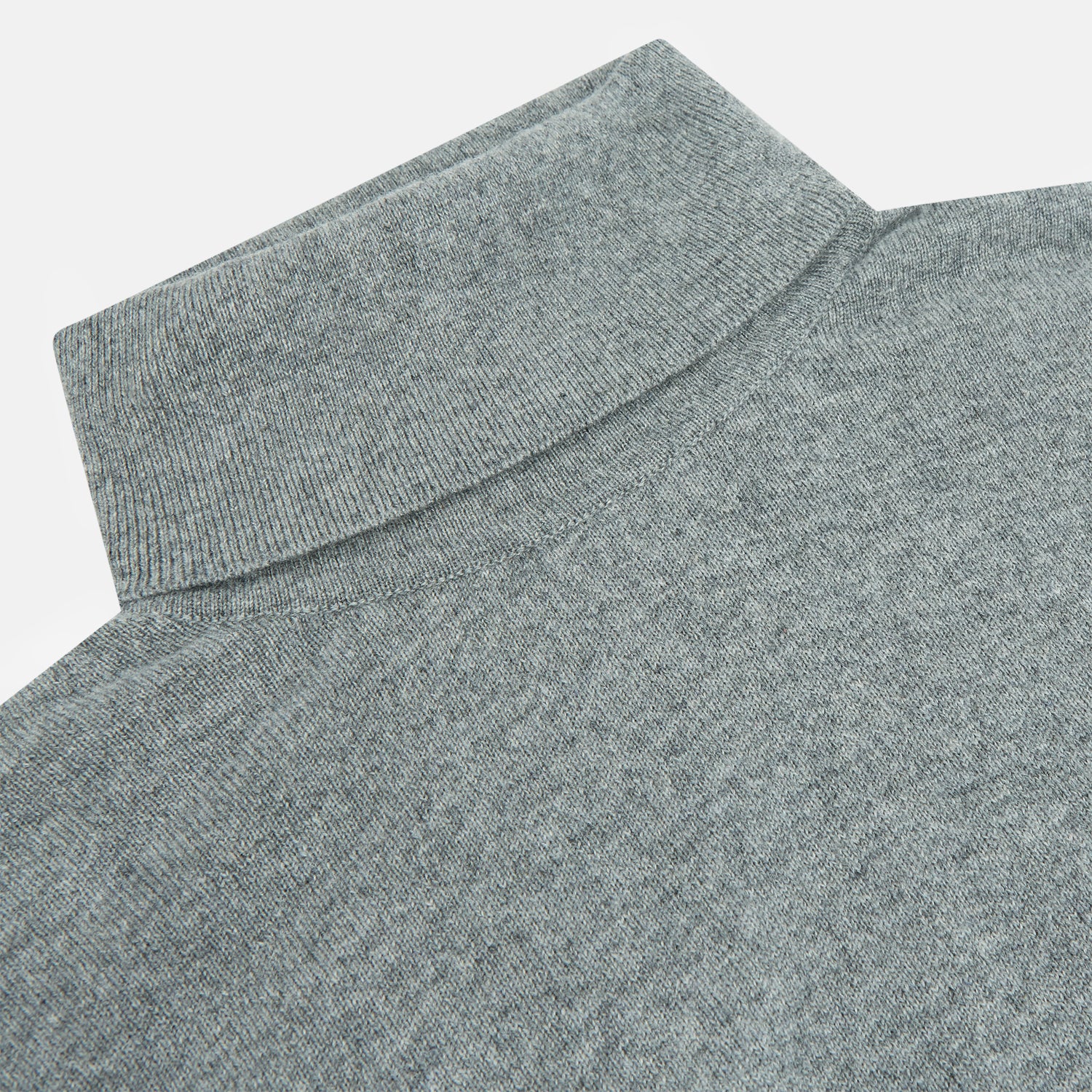 View 2 of product The Turnbull & Asser Kylian Flannel Grey Roll Neck Jumper features long sleeves, ribbed cuffs and hem—ideal for autumn layering. Laid flat on a white background.