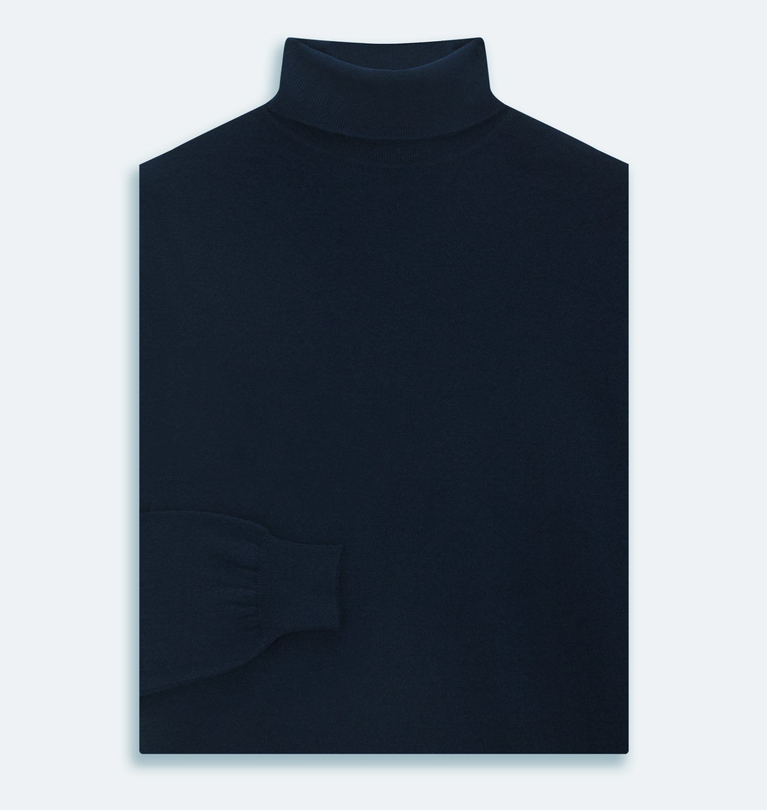 View 3 of product The Turnbull & Asser Navy Cashmere Roll Neck Jumper, with ribbed cuffs and hem, is a timeless autumn essential. Shown laid flat on a white background, this plain long-sleeved sweater offers classic style and comfort.