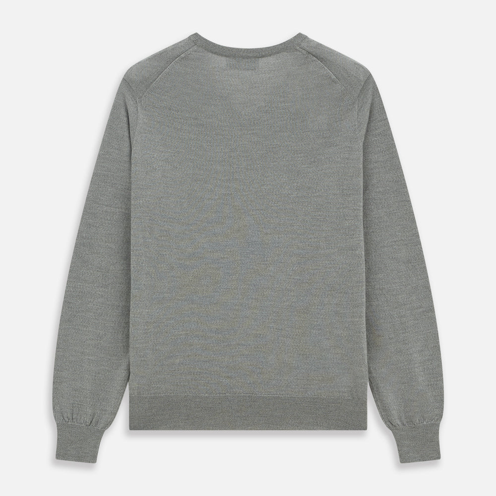 The Grey V-Neck Merino Wool Jumper by Turnbull & Asser features long sleeves with ribbed cuffs and hem, making it a versatile wardrobe essential for any gentleman. Shown here in classic light grey on a white background.