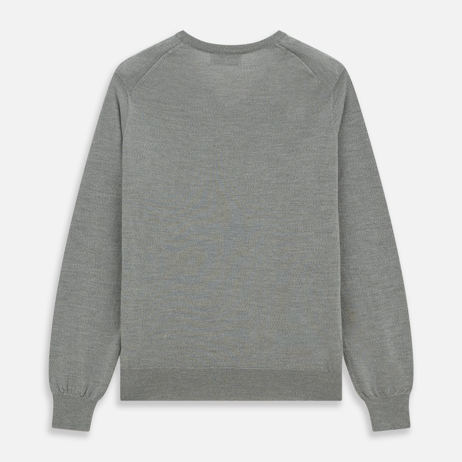 View 4 of product The Grey V-Neck Merino Wool Jumper by Turnbull & Asser features long sleeves with ribbed cuffs and hem, making it a versatile wardrobe essential for any gentleman. Shown here in classic light grey on a white background.