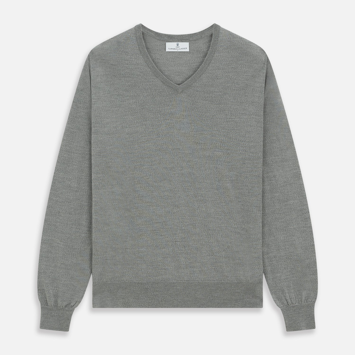 View 1 of product The Grey V-Neck Merino Wool Jumper by Turnbull & Asser features long sleeves with ribbed cuffs and hem, making it a versatile wardrobe essential for any gentleman. Shown here in classic light grey on a white background.