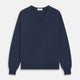 The Blue V-Neck Merino Wool Jumper by Turnbull & Asser features long sleeves, ribbed cuffs, and a ribbed hem—a timeless essential for any gentleman's wardrobe, shown laid flat on a white background.