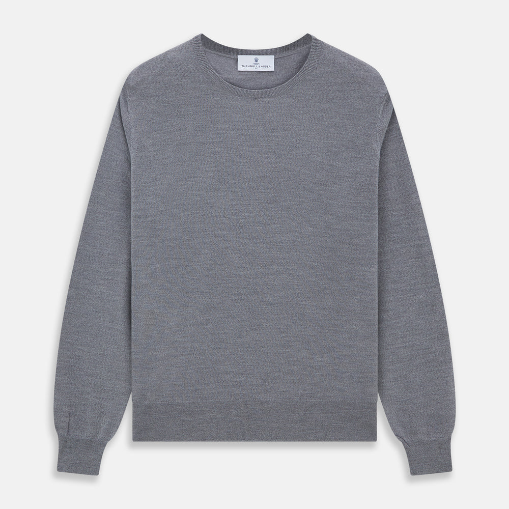 The Turnbull & Asser Grey Crew Neck Merino Wool Jumper, a timeless long-sleeved staple, is shown laid flat on a white background.
