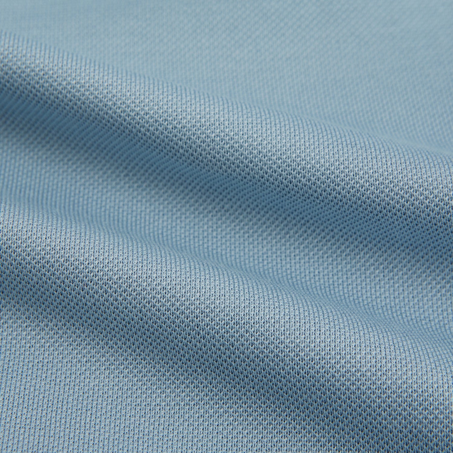 View 6 of product The Turnbull & Asser Pale Blue Pique Shirt is a long-sleeve button-up with an open collar, single chest pocket, and beige buttons, shown against a white background.