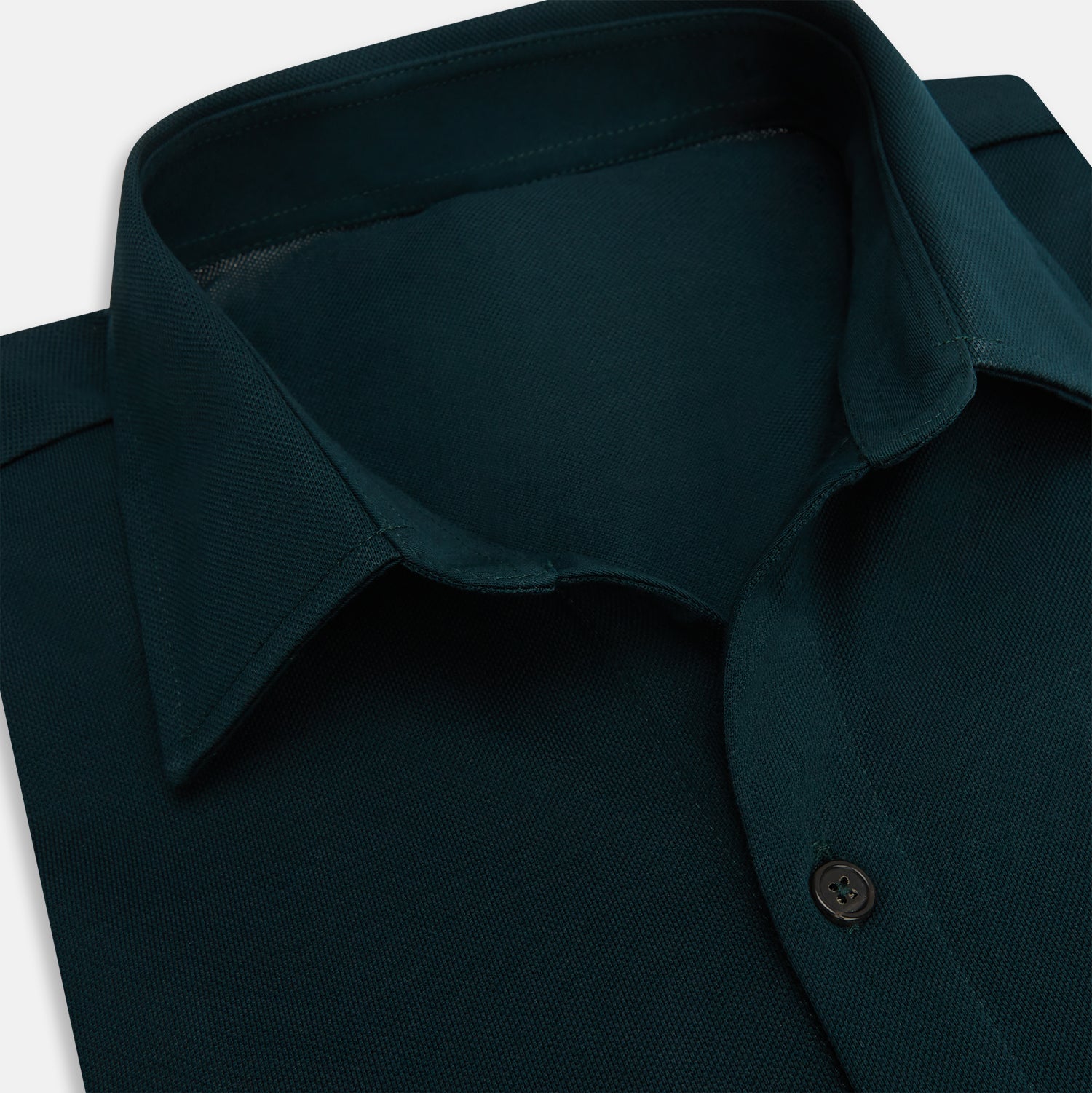 View 2 of product The Turnbull & Asser Dark Green Pique Shirt features long sleeves, a button-up front, chest pocket, and an elevated silhouette, displayed flat on a white background.