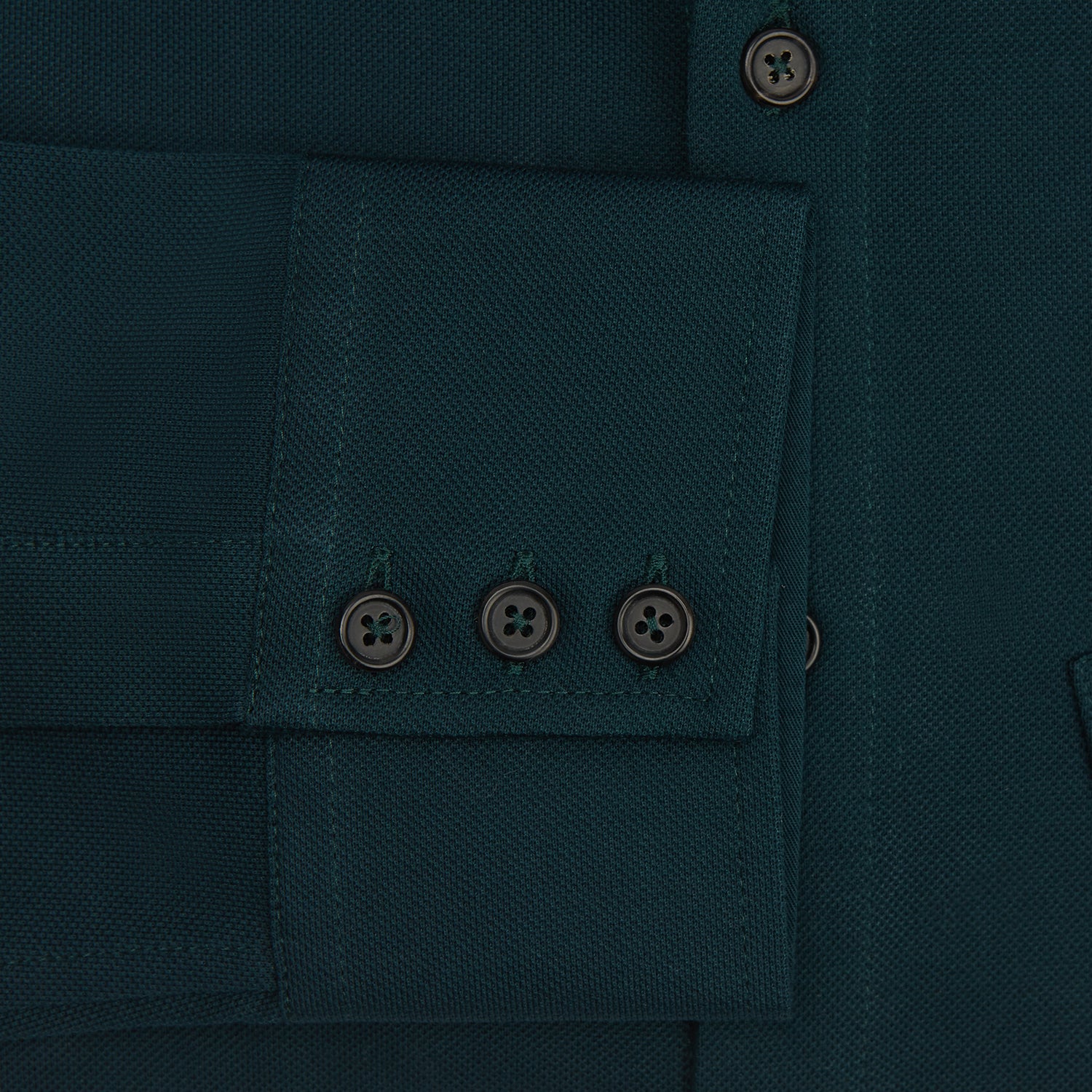 View 3 of product The Turnbull & Asser Dark Green Pique Shirt features long sleeves, a button-up front, chest pocket, and an elevated silhouette, displayed flat on a white background.