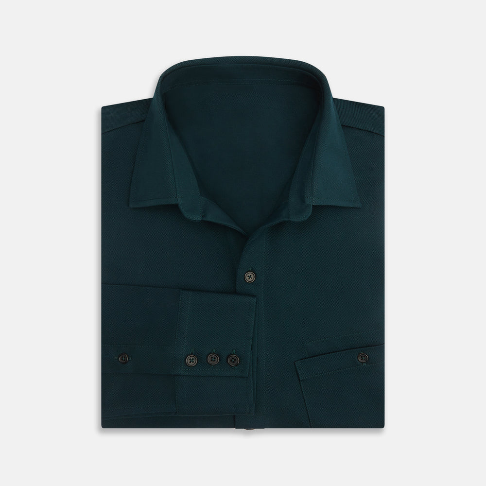 The Turnbull & Asser Dark Green Pique Shirt features long sleeves, a button-up front, chest pocket, and an elevated silhouette, displayed flat on a white background.