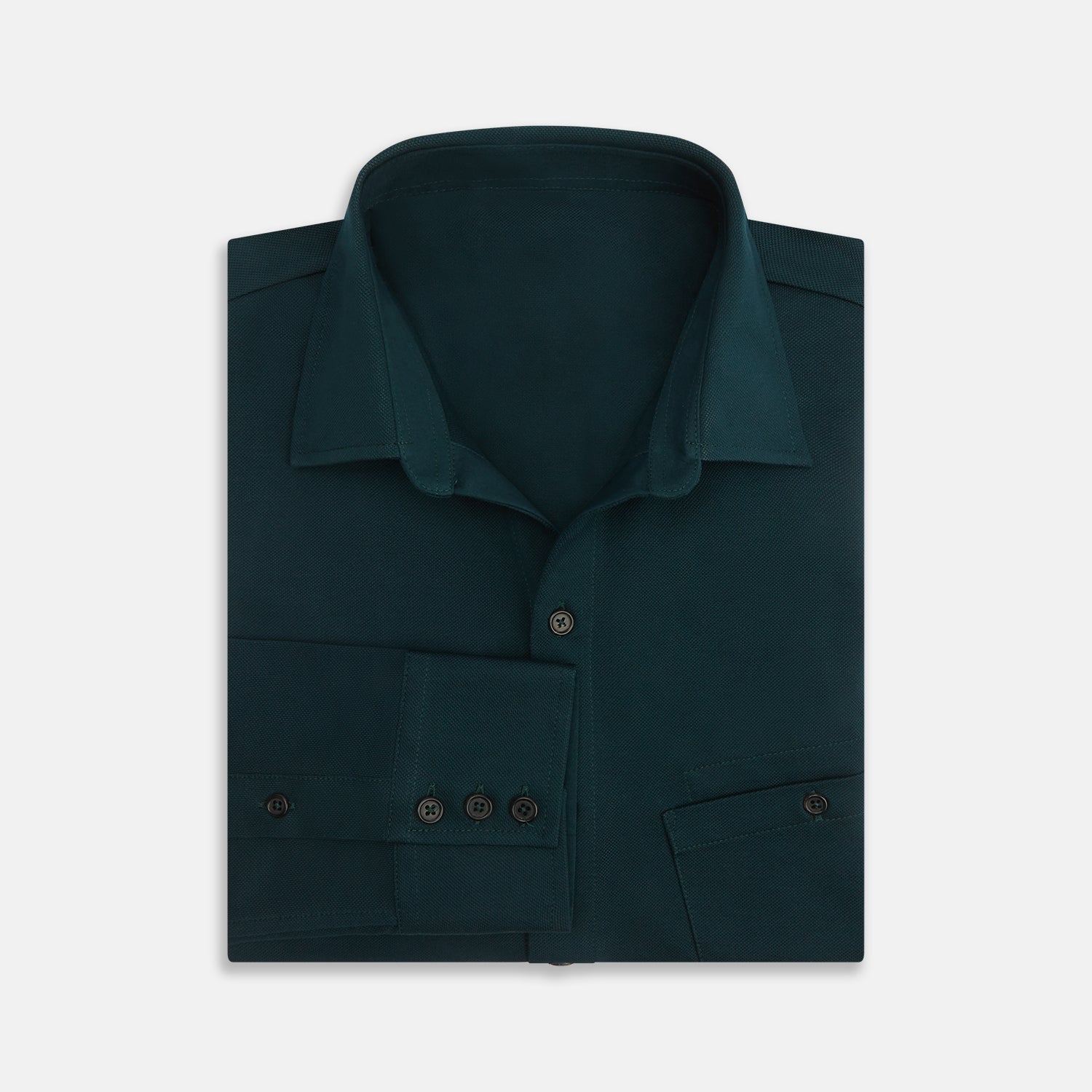 View 4 of product The Turnbull & Asser Dark Green Pique Shirt features long sleeves, a button-up front, chest pocket, and an elevated silhouette, displayed flat on a white background.