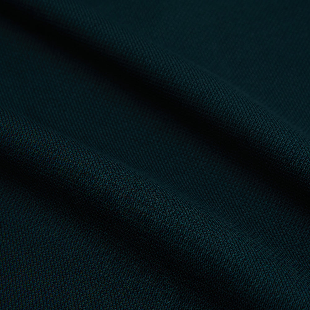 The Turnbull & Asser Dark Green Pique Shirt features long sleeves, a button-up front, chest pocket, and an elevated silhouette, displayed flat on a white background.