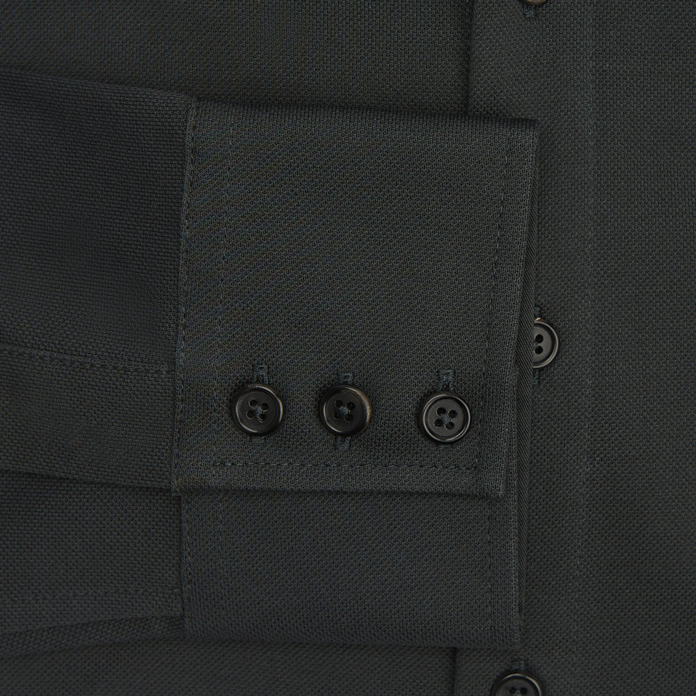 The Moss Green Pique Shirt by Turnbull & Asser, featuring long sleeves, a button-up front, collar, and single chest pocket, is laid flat on a white background for a refined take on classic style.