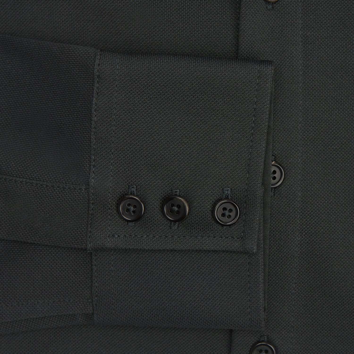 View 4 of product The Moss Green Pique Shirt by Turnbull & Asser, featuring long sleeves, a button-up front, collar, and single chest pocket, is laid flat on a white background for a refined take on classic style.