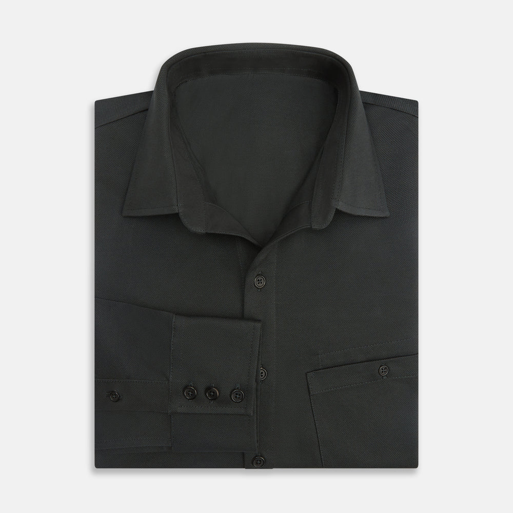 The Moss Green Pique Shirt by Turnbull & Asser, featuring long sleeves, a button-up front, collar, and single chest pocket, is laid flat on a white background for a refined take on classic style.