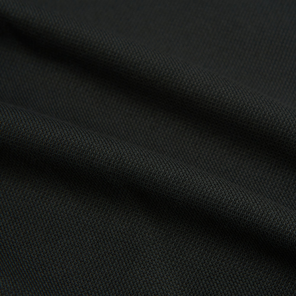 The Moss Green Pique Shirt by Turnbull & Asser, featuring long sleeves, a button-up front, collar, and single chest pocket, is laid flat on a white background for a refined take on classic style.