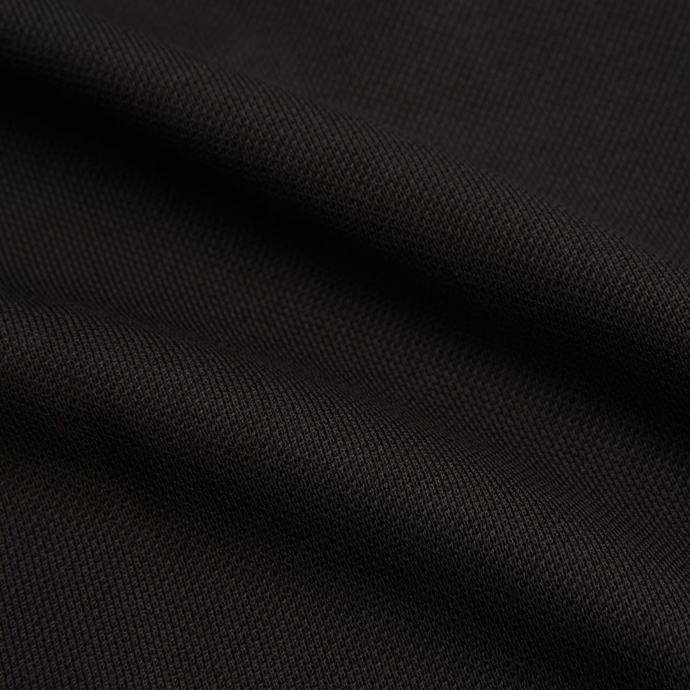 A Brown Pique Shirt by Turnbull & Asser, featuring long sleeves, a collar, and a single chest pocket, is laid flat on a white background.