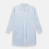 View 1 of product The Turnbull & Asser Pale Blue Fine Micro Check Nightshirt is a relaxed-fit, long-sleeve sleepwear piece with a collar, chest pocket, buttoned half-placket, and front pleat, shown against a plain white background.