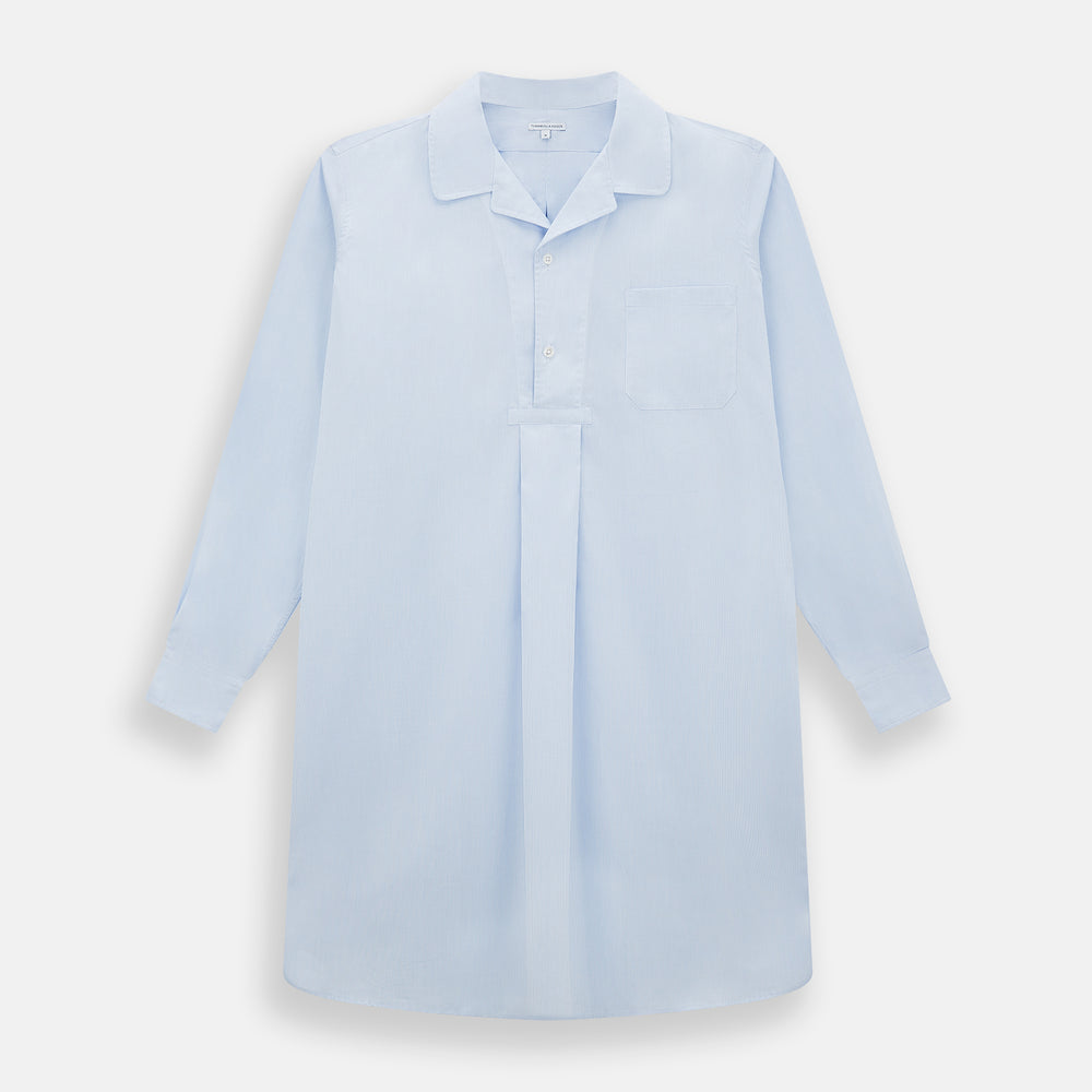 The Turnbull & Asser Pale Blue Fine Micro Check Nightshirt is a relaxed-fit, long-sleeve sleepwear piece with a collar, chest pocket, buttoned half-placket, and front pleat, shown against a plain white background.
