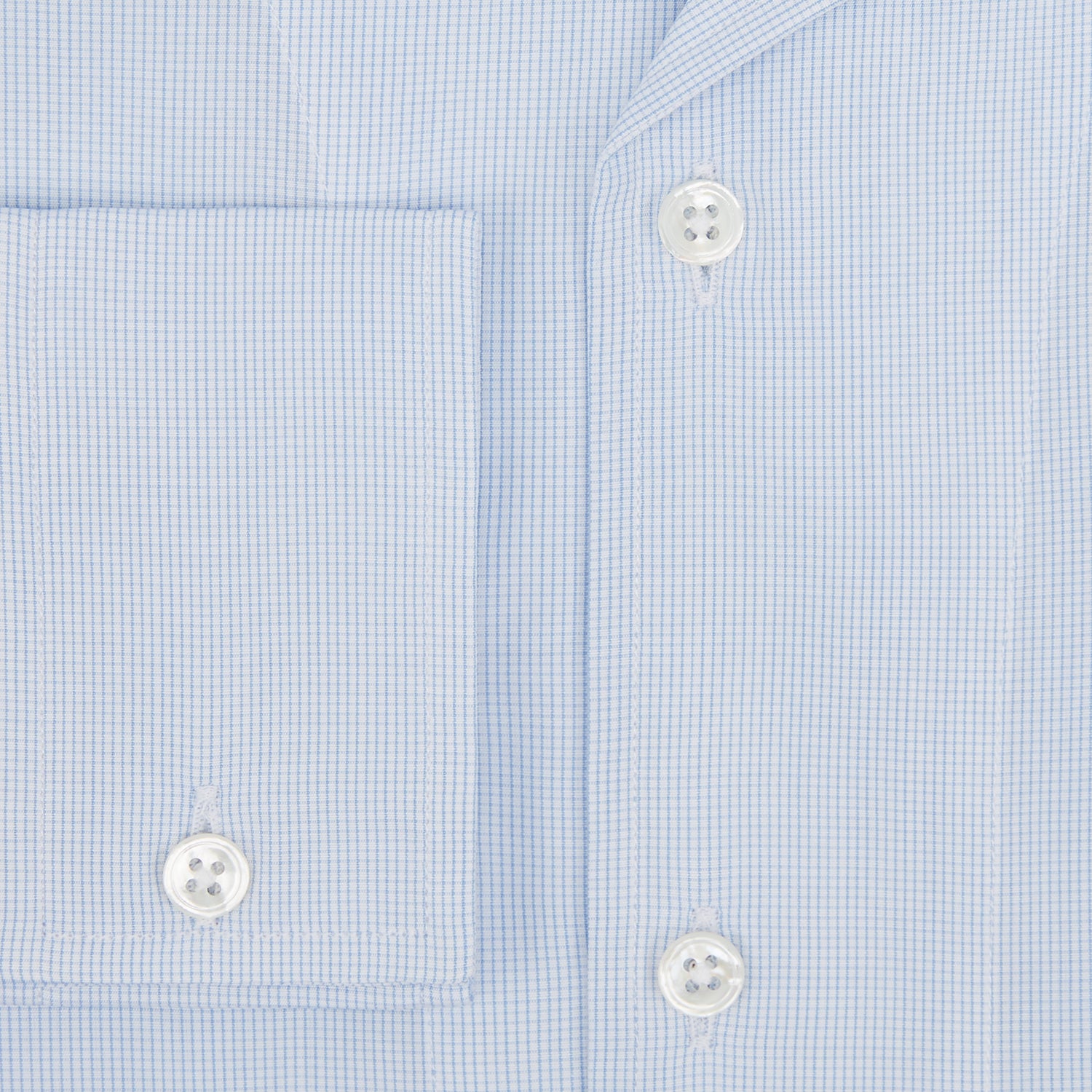 View 4 of product The Turnbull & Asser Pale Blue Fine Micro Check Nightshirt is a relaxed-fit, long-sleeve sleepwear piece with a collar, chest pocket, buttoned half-placket, and front pleat, shown against a plain white background.