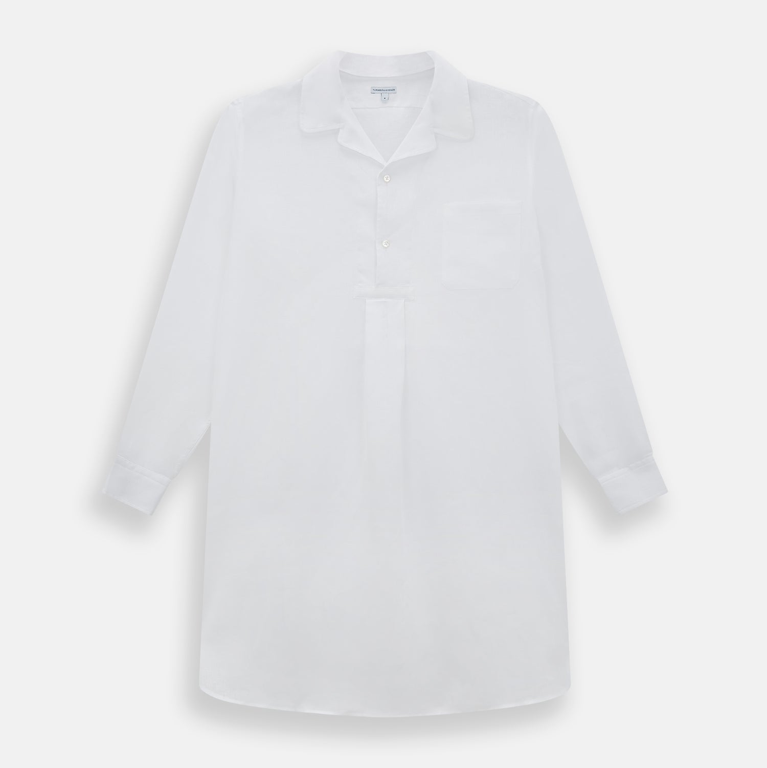 View 1 of product The Turnbull & Asser White Linen Nightshirt features long sleeves, a buttoned placket, single chest pocket, and relaxed fit—perfect for stylish sleepwear. Shown laid flat on a white background.