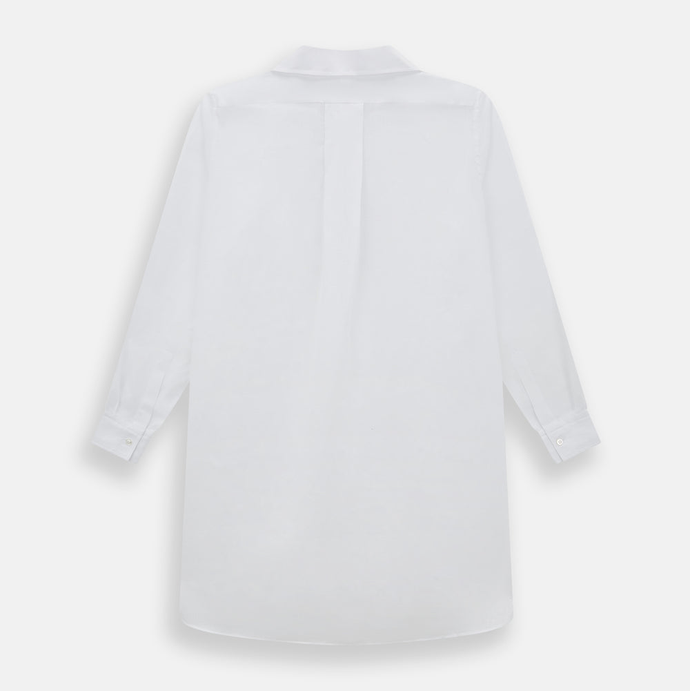 The Turnbull & Asser White Linen Nightshirt features long sleeves, a buttoned placket, single chest pocket, and relaxed fit—perfect for stylish sleepwear. Shown laid flat on a white background.
