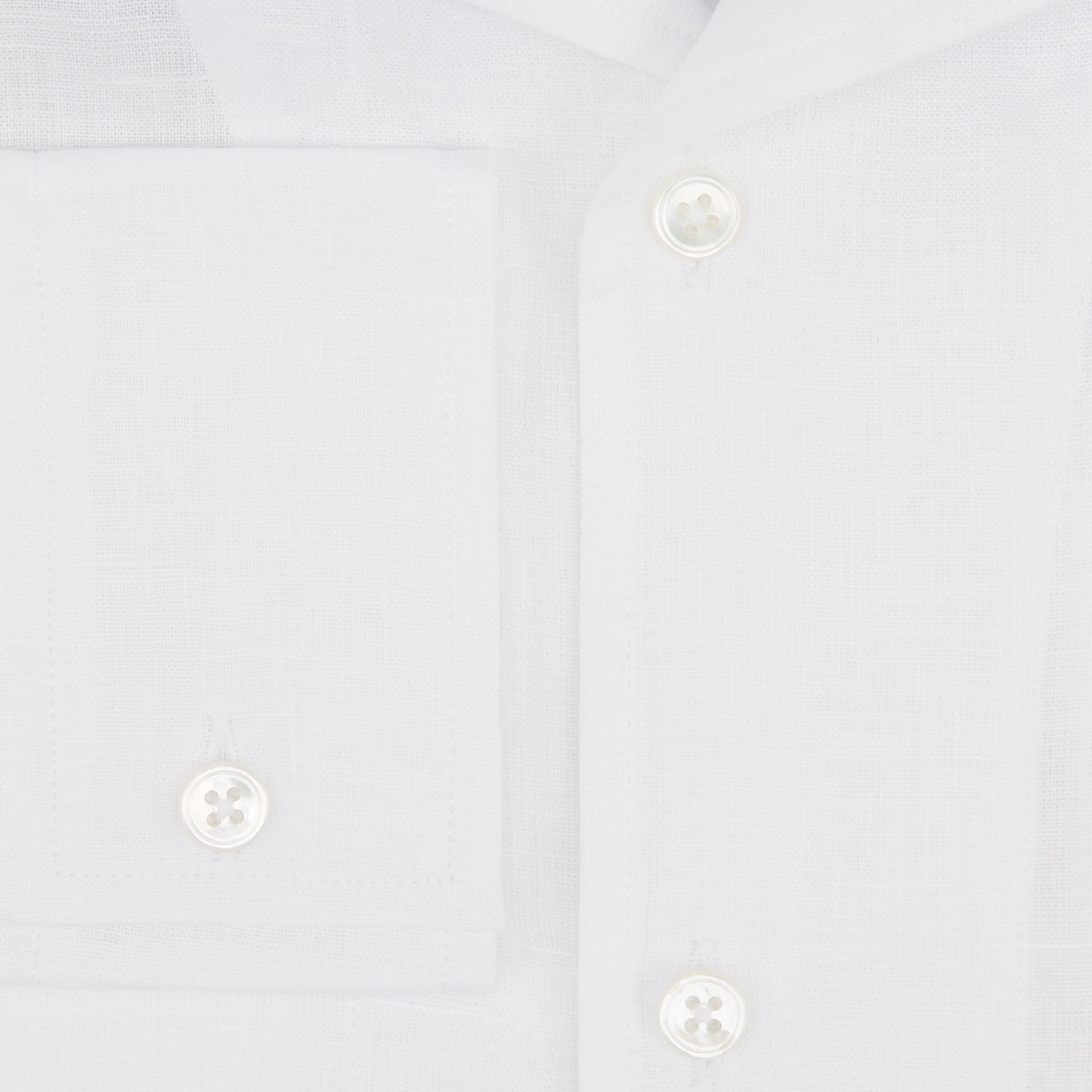 View 4 of product The Turnbull & Asser White Linen Nightshirt features long sleeves, a buttoned placket, single chest pocket, and relaxed fit—perfect for stylish sleepwear. Shown laid flat on a white background.