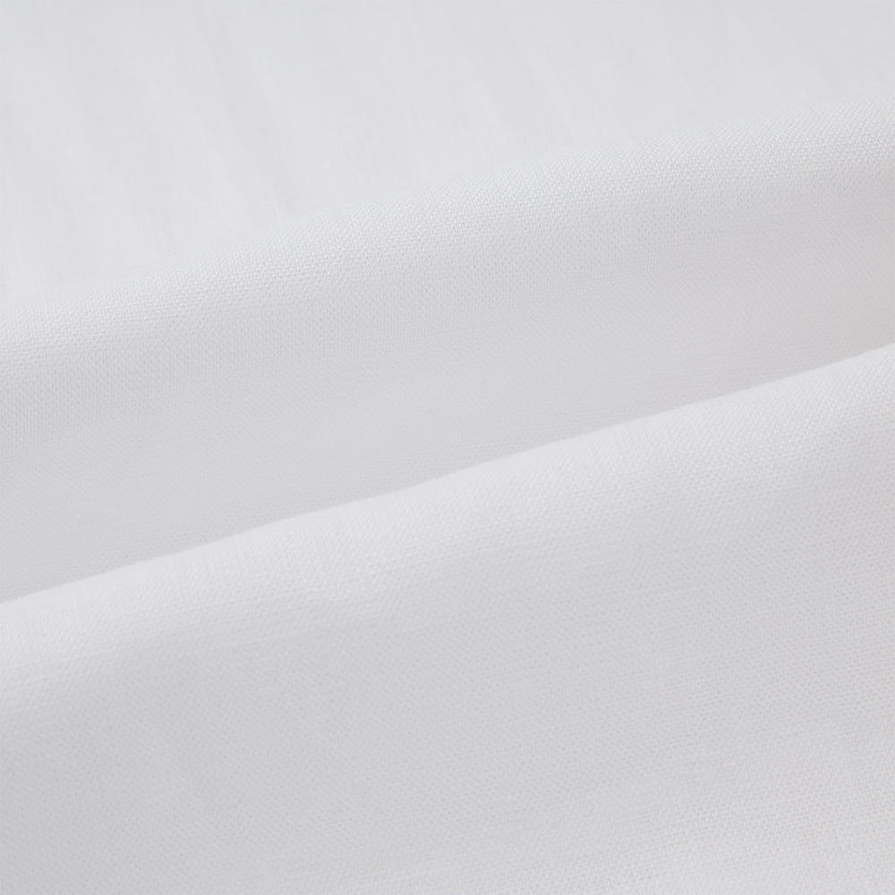 The Turnbull & Asser White Linen Nightshirt features long sleeves, a buttoned placket, single chest pocket, and relaxed fit—perfect for stylish sleepwear. Shown laid flat on a white background.