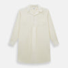 View 1 of product The Cream Nightshirt by Turnbull & Asser is a long-sleeved, cream-colored shirt dress with a collar, partial button front, chest pocket, and relaxed fit—ideal as comfortable sleepwear—shown on a plain white background.