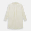 View 3 of product The Cream Nightshirt by Turnbull & Asser is a long-sleeved, cream-colored shirt dress with a collar, partial button front, chest pocket, and relaxed fit—ideal as comfortable sleepwear—shown on a plain white background.