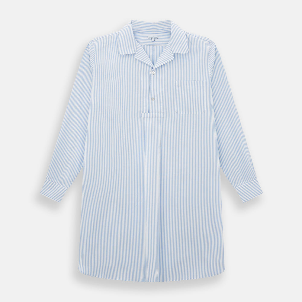 The Turnbull & Asser Pale Blue Bengal Stripe Nightshirt features light blue and white vertical stripes, a collar, chest pocket, and upper front buttons—perfect relaxing sleepwear, shown on a white background.