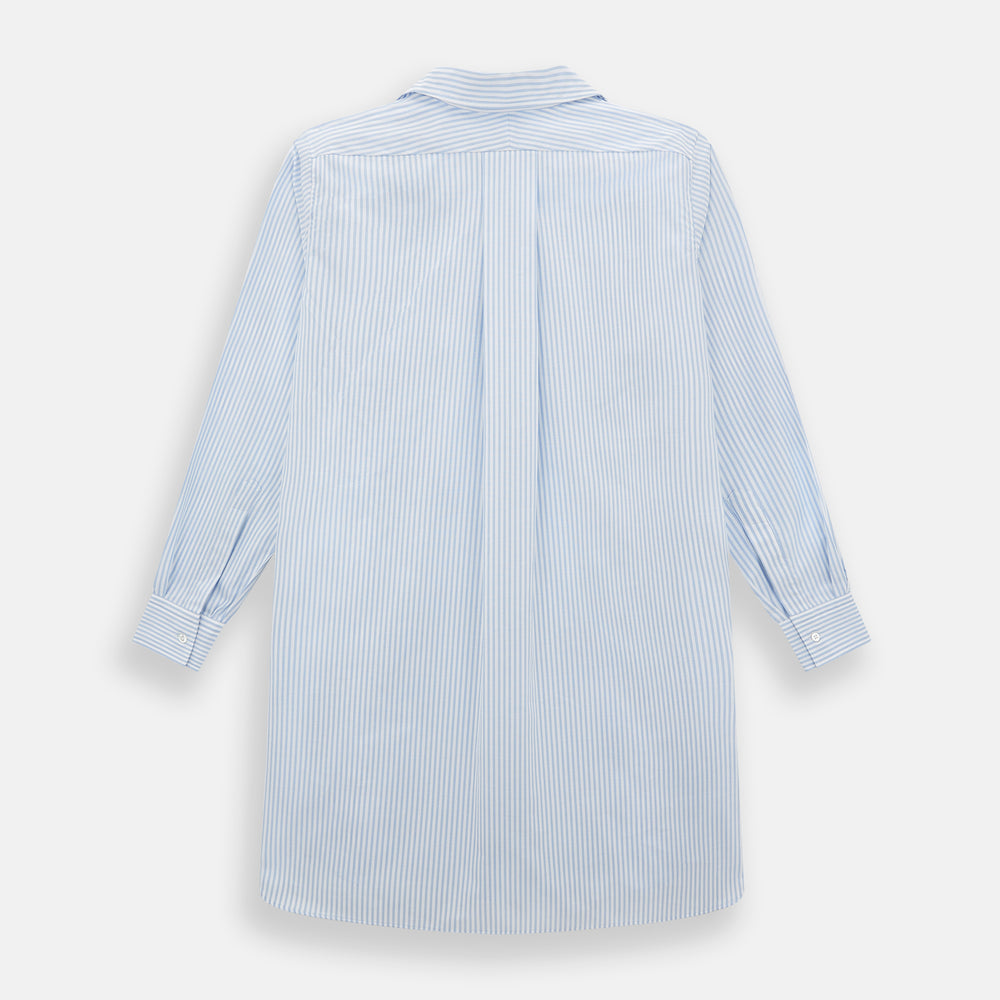 The Turnbull & Asser Pale Blue Bengal Stripe Nightshirt features light blue and white vertical stripes, a collar, chest pocket, and upper front buttons—perfect relaxing sleepwear, shown on a white background.
