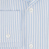 View 4 of product The Turnbull & Asser Pale Blue Bengal Stripe Nightshirt features light blue and white vertical stripes, a collar, chest pocket, and upper front buttons—perfect relaxing sleepwear, shown on a white background.