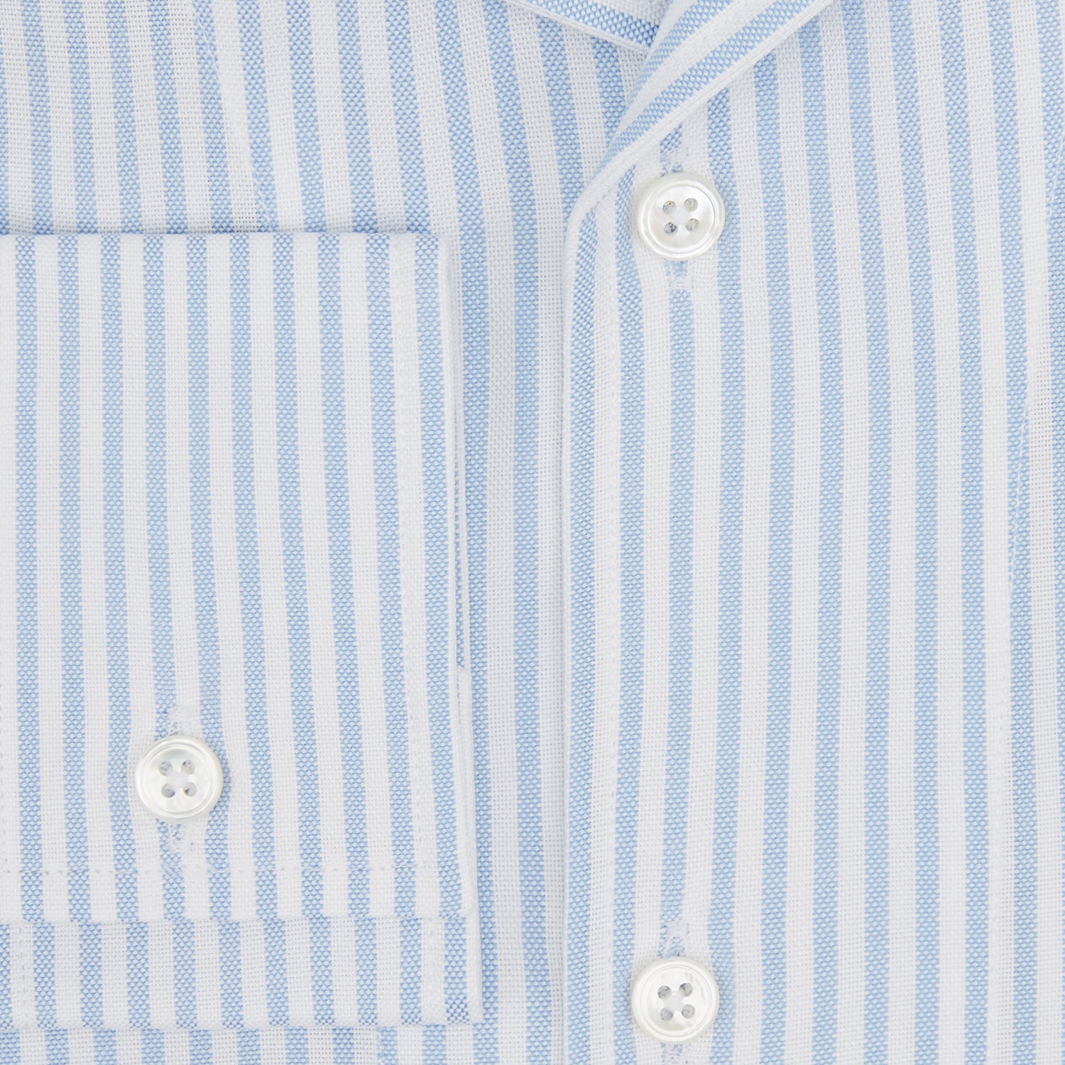 View 4 of product The Turnbull & Asser Pale Blue Bengal Stripe Nightshirt features light blue and white vertical stripes, a collar, chest pocket, and upper front buttons—perfect relaxing sleepwear, shown on a white background.