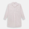 View 1 of product The Turnbull & Asser Pale Pink Bengal Stripe Nightshirt features long sleeves, a subtle striped pattern, a collar, chest pocket, and front buttons. Shown flat on a white background, this stylish sleepwear offers comfort and elegance.