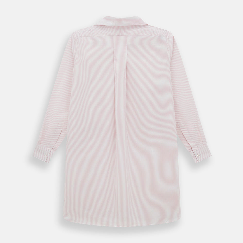 The Turnbull & Asser Pale Pink Bengal Stripe Nightshirt features long sleeves, a subtle striped pattern, a collar, chest pocket, and front buttons. Shown flat on a white background, this stylish sleepwear offers comfort and elegance.