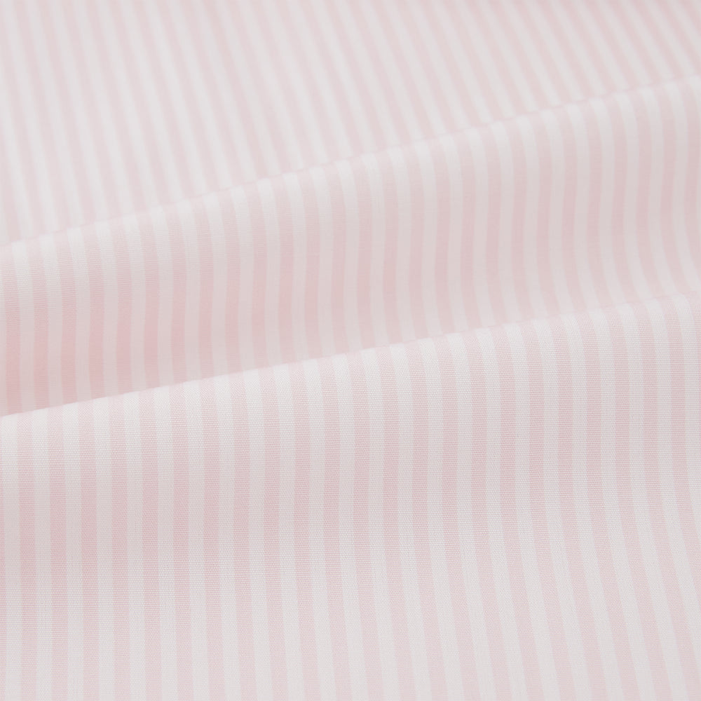 The Turnbull & Asser Pale Pink Bengal Stripe Nightshirt features long sleeves, a subtle striped pattern, a collar, chest pocket, and front buttons. Shown flat on a white background, this stylish sleepwear offers comfort and elegance.