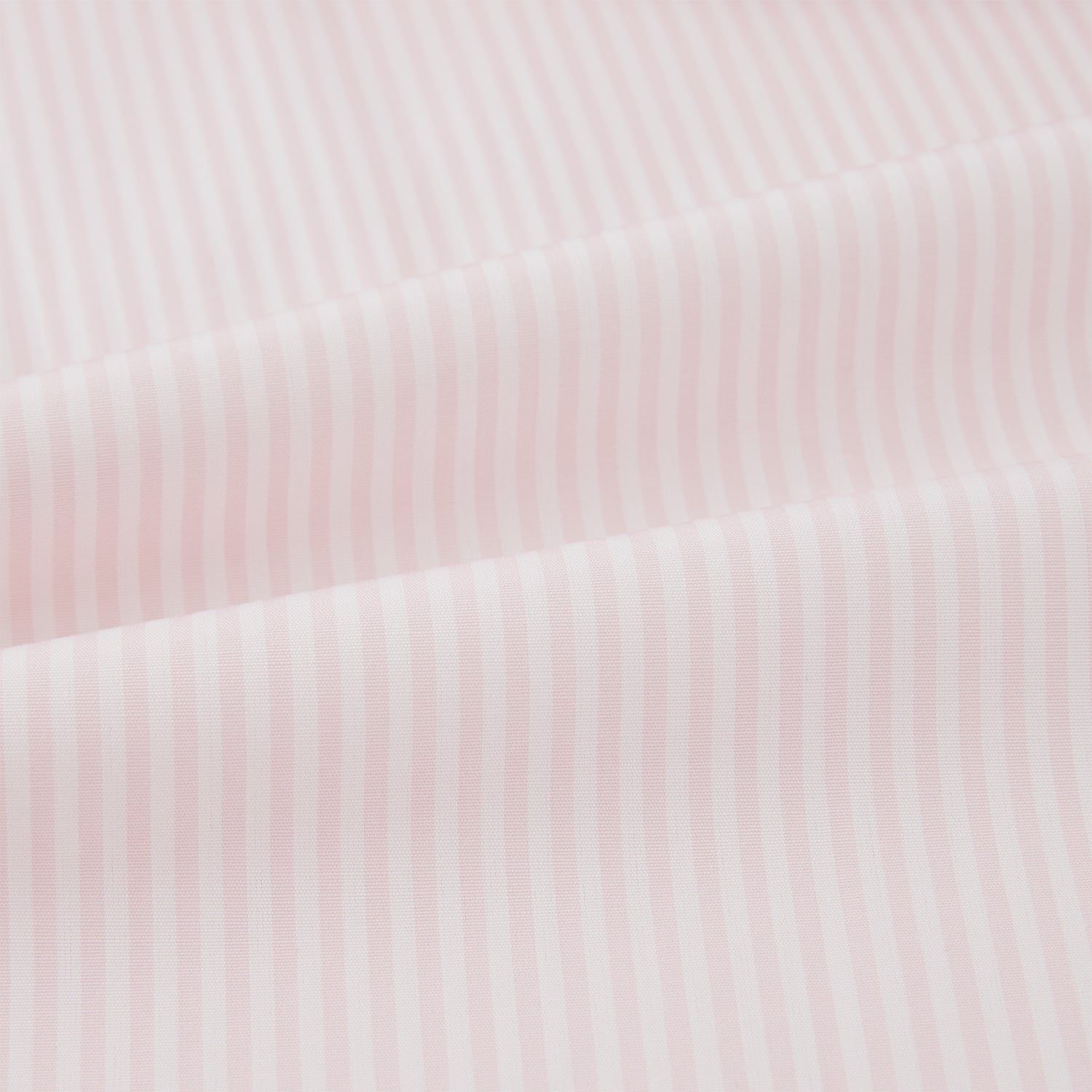 View 5 of product The Turnbull & Asser Pale Pink Bengal Stripe Nightshirt features long sleeves, a subtle striped pattern, a collar, chest pocket, and front buttons. Shown flat on a white background, this stylish sleepwear offers comfort and elegance.