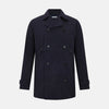 View 1 of product The Navy Short Albert Trench Coat by Turnbull & Asser UK features dark navy fabric, six black buttons, a notched collar, long sleeves with adjustable cuffs, and front zip pockets—displayed on a plain white background.