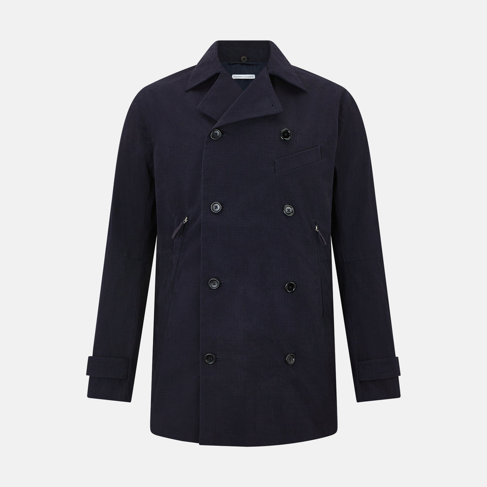 The Navy Short Albert Trench Coat by Turnbull & Asser UK features dark navy fabric, six black buttons, a notched collar, long sleeves with adjustable cuffs, and front zip pockets—displayed on a plain white background.