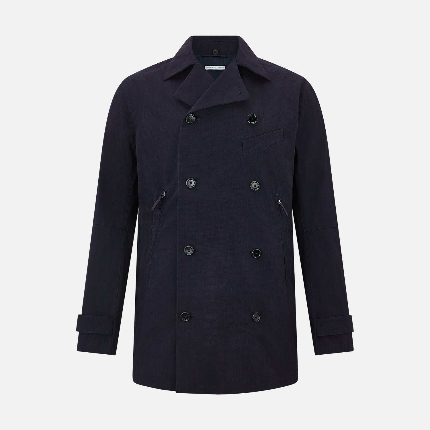 View 1 of product The Navy Short Albert Trench Coat by Turnbull & Asser UK features dark navy fabric, six black buttons, a notched collar, long sleeves with adjustable cuffs, and front zip pockets—displayed on a plain white background.