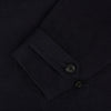 View 4 of product The Navy Short Albert Trench Coat by Turnbull & Asser UK features dark navy fabric, six black buttons, a notched collar, long sleeves with adjustable cuffs, and front zip pockets—displayed on a plain white background.