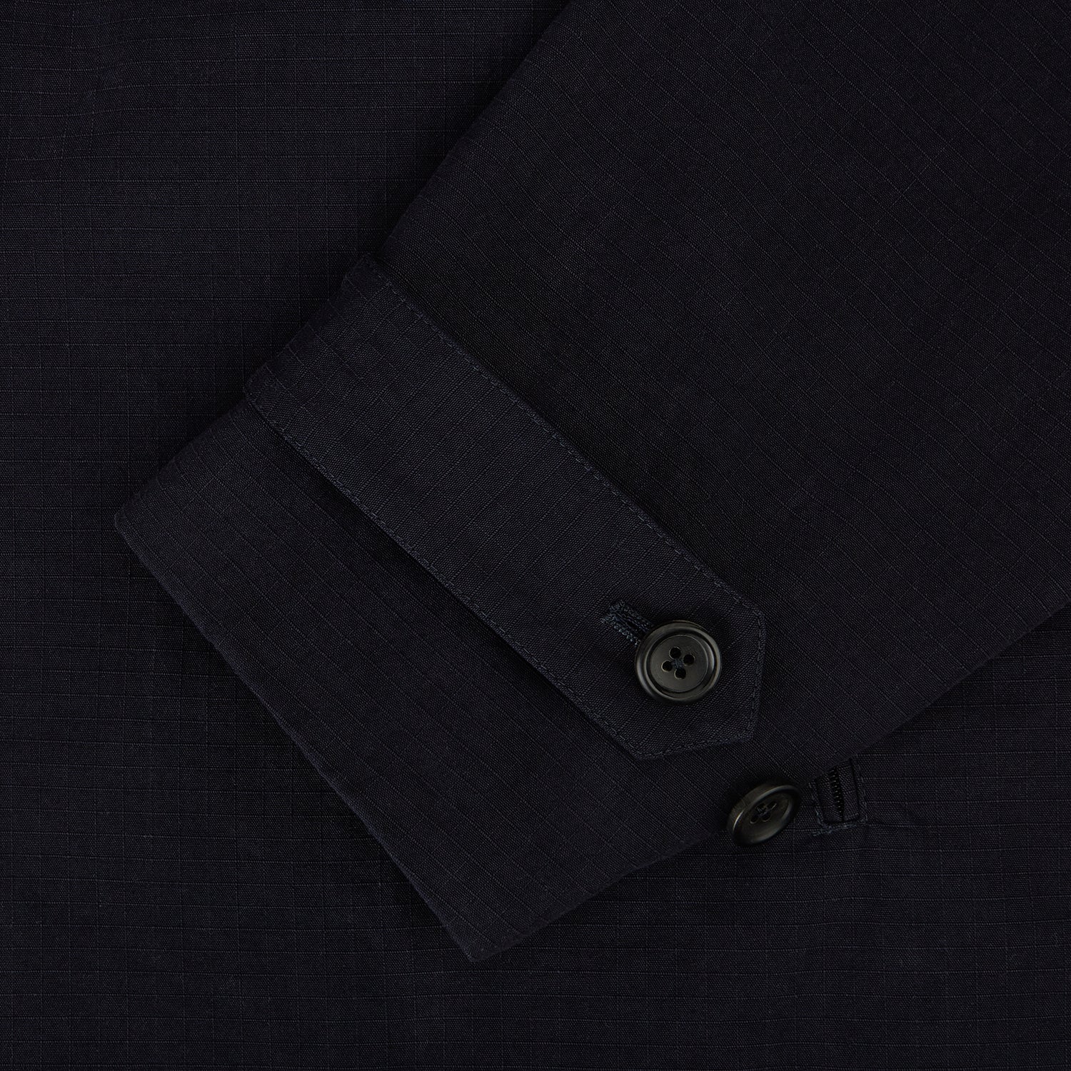 View 4 of product The Navy Short Albert Trench Coat by Turnbull & Asser UK features dark navy fabric, six black buttons, a notched collar, long sleeves with adjustable cuffs, and front zip pockets—displayed on a plain white background.