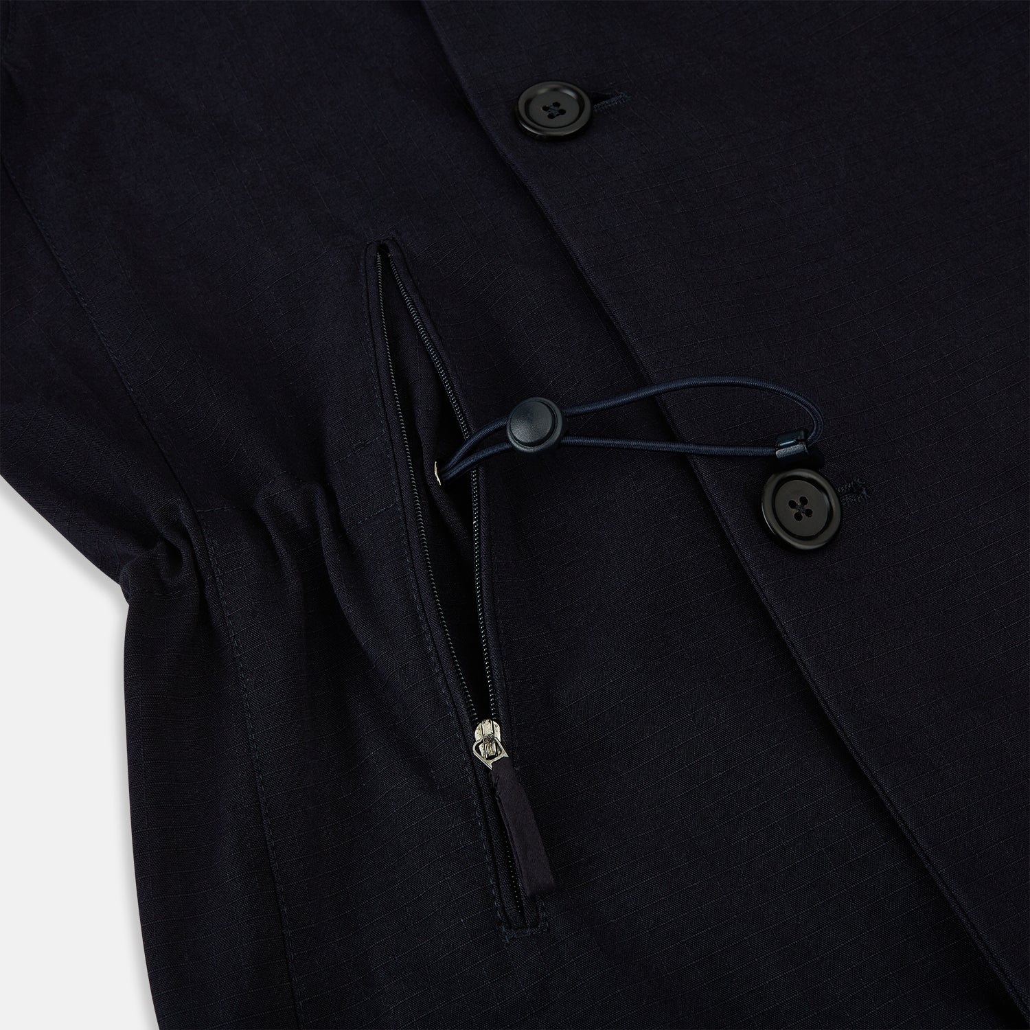 View 5 of product The Navy Short Albert Trench Coat by Turnbull & Asser UK features dark navy fabric, six black buttons, a notched collar, long sleeves with adjustable cuffs, and front zip pockets—displayed on a plain white background.