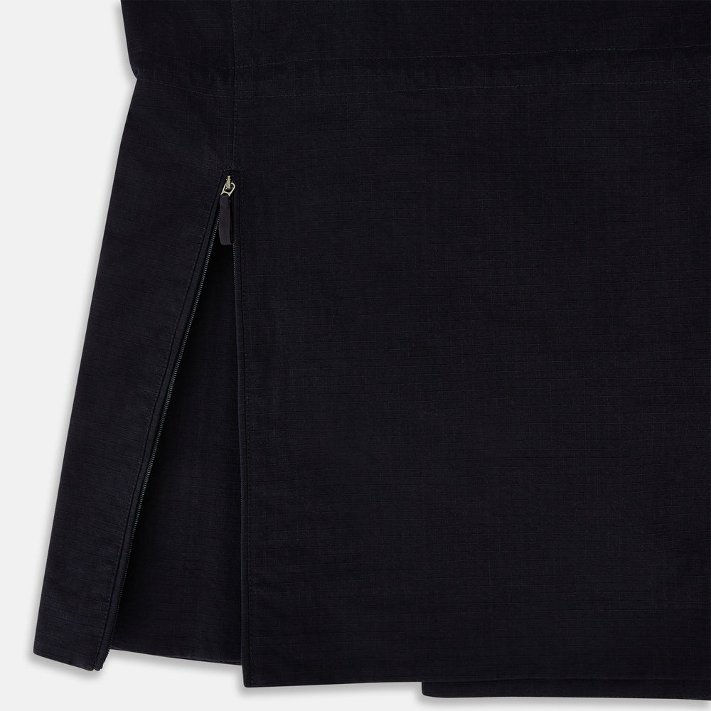 The Navy Short Albert Trench Coat by Turnbull & Asser UK features dark navy fabric, six black buttons, a notched collar, long sleeves with adjustable cuffs, and front zip pockets—displayed on a plain white background.