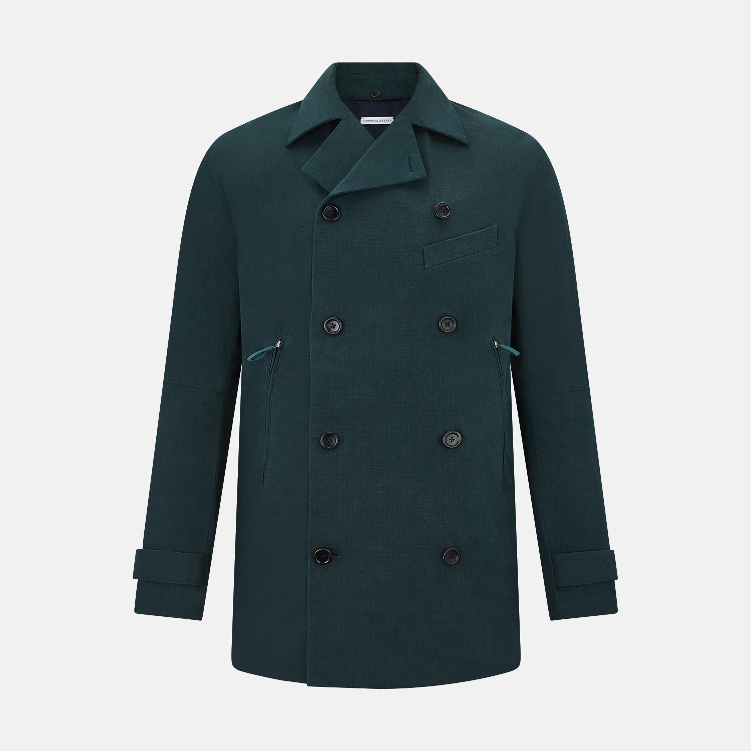 View 1 of product Turnbull & Asser UK's Forest Green Short Albert Trench Coat features a double-breasted design, black buttons, front chest pocket, two zippered side pockets, and strapped cuffs, shown against a plain white background.