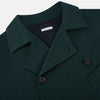 View 2 of product Turnbull & Asser UK's Forest Green Short Albert Trench Coat features a double-breasted design, black buttons, front chest pocket, two zippered side pockets, and strapped cuffs, shown against a plain white background.