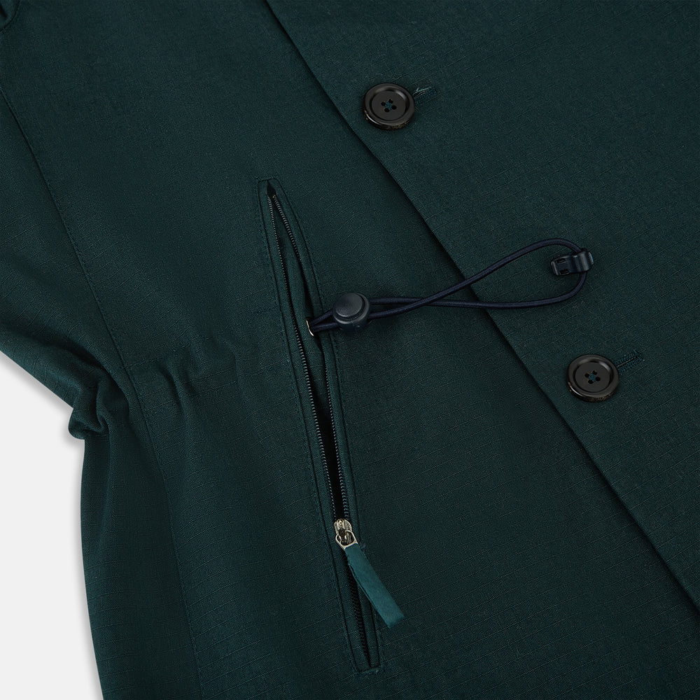 Turnbull & Asser UK's Forest Green Short Albert Trench Coat features a double-breasted design, black buttons, front chest pocket, two zippered side pockets, and strapped cuffs, shown against a plain white background.
