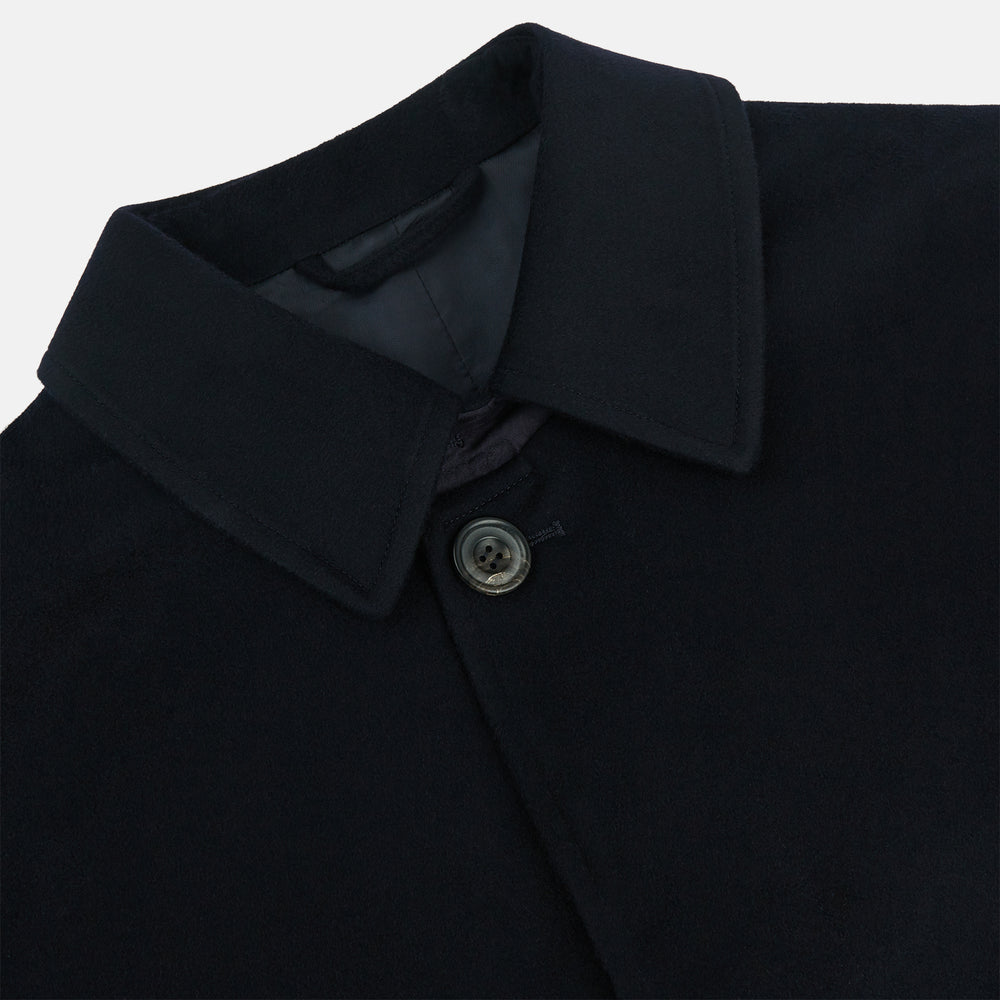 The Turnbull & Asser Dark Navy Cashmere Storm System Smith Coat, featuring a classic collar, buttoned front, side pockets, and buttoned cuffs, is shown laid flat on a white background.