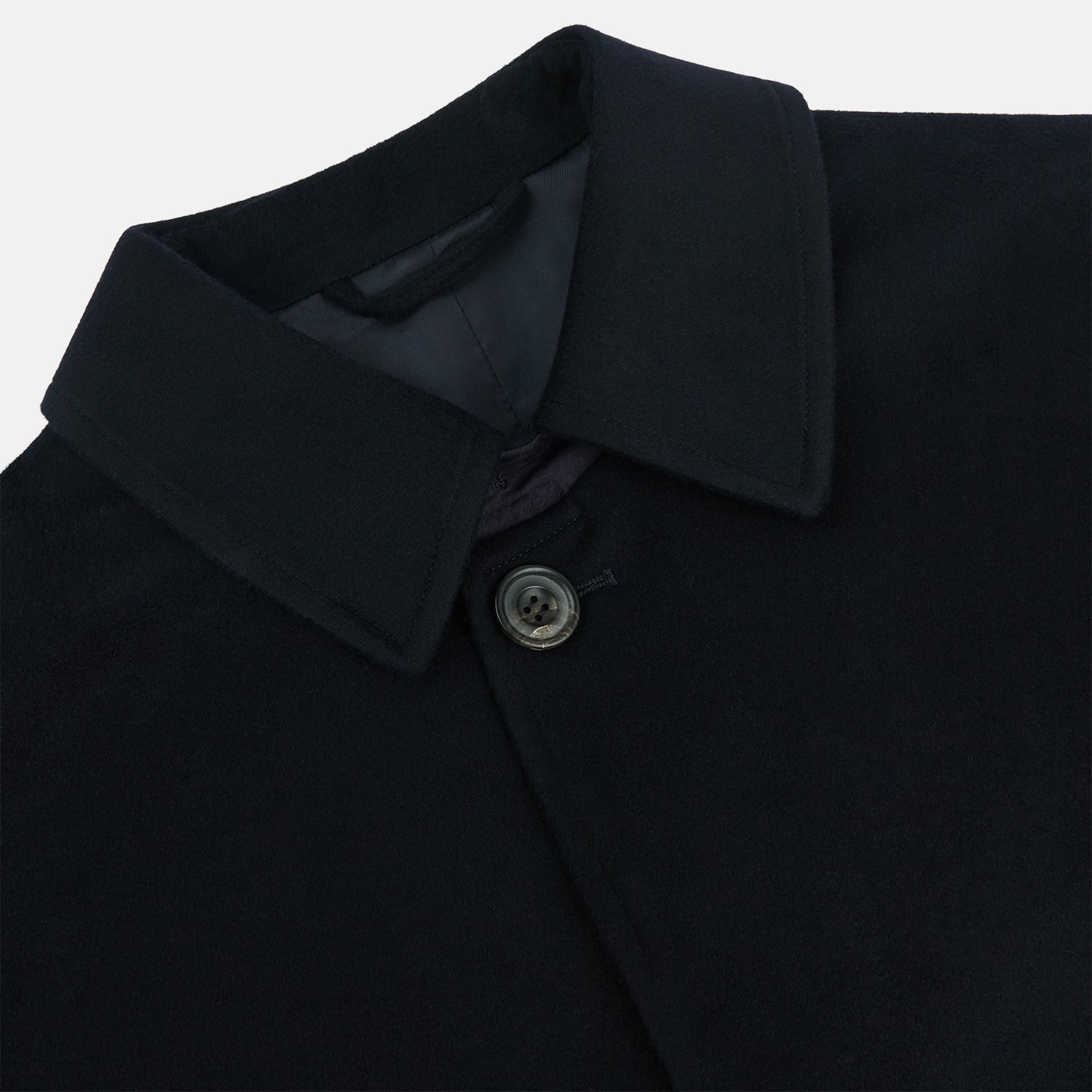 View 2 of product The Turnbull & Asser Dark Navy Cashmere Storm System Smith Coat, featuring a classic collar, buttoned front, side pockets, and buttoned cuffs, is shown laid flat on a white background.